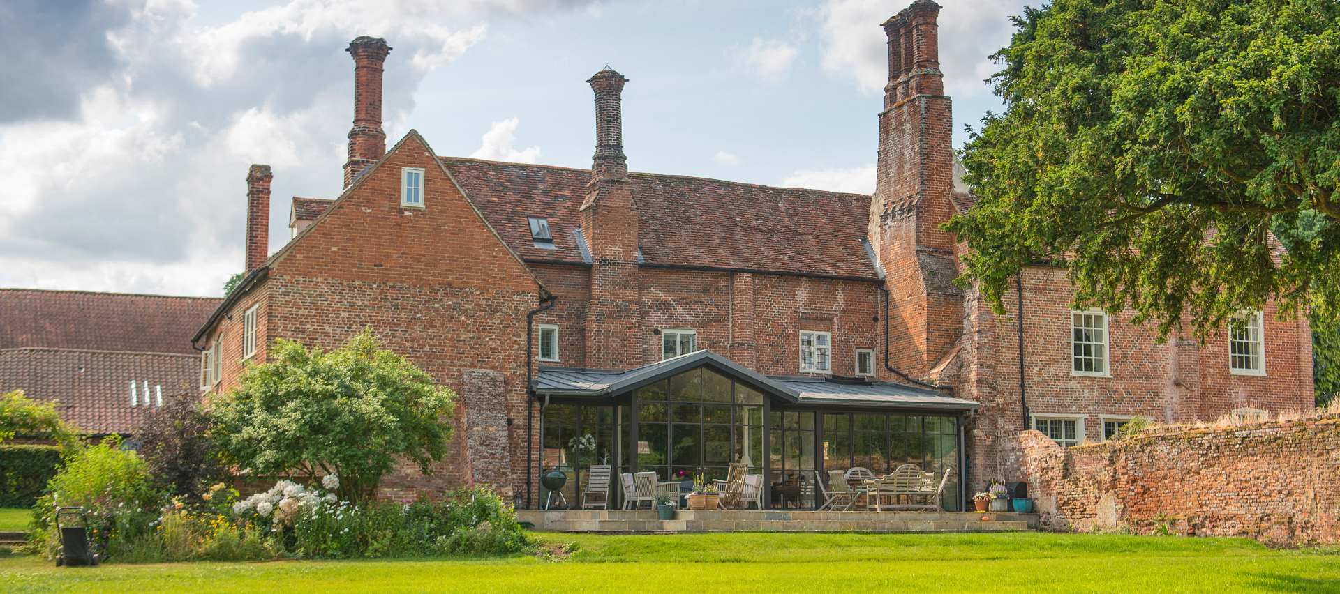 Contemporary Glazed Extension added to an Historic Tudor Courthouse